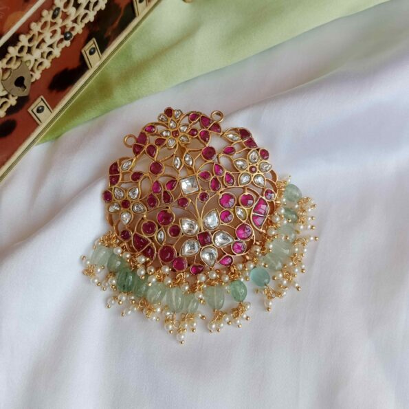 Intricately designed Jadau pendant with light green bead drops