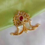 Exclusive ruby and AD tigers nail pendant
