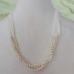 Six strands of pearl/black beads chain