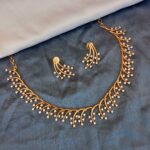 Stylish gold and American diamond neckset