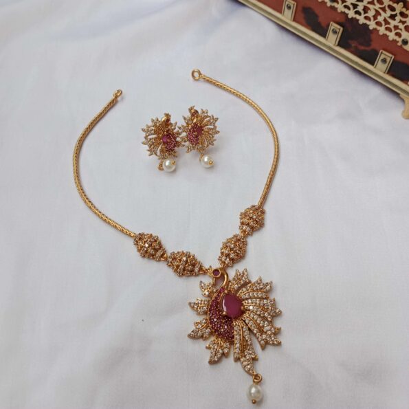 Big peacock studded with rubies and CZ stones neckset