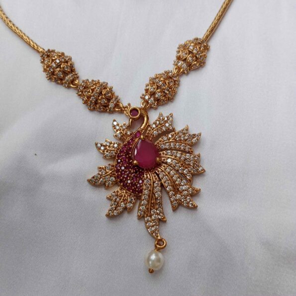 Big peacock studded with rubies and CZ stones neckset