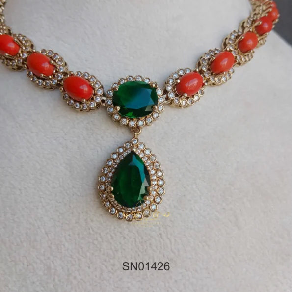 Elegant Coral Necklace with Emerald in Middle