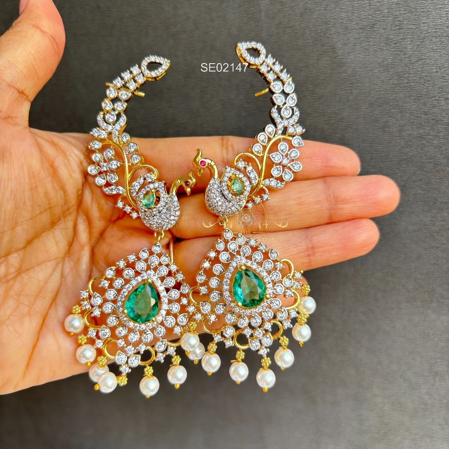 2147_2_1.webp peacock AD Earcuffs